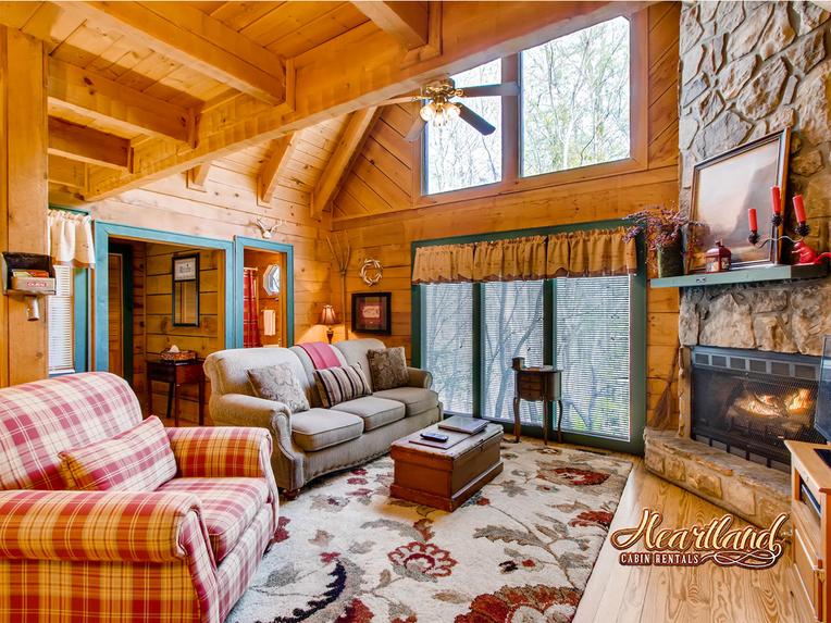 Living room with fireplace and TV